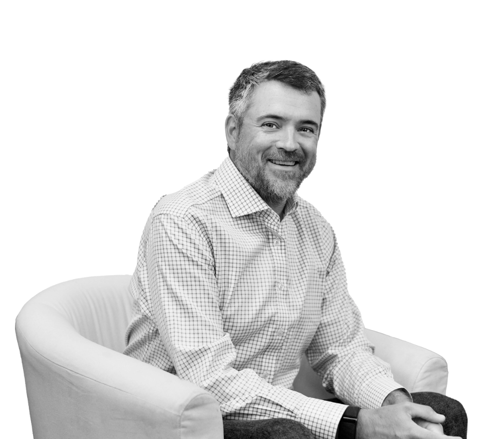 Photo of CEO Pete Czech sitting on an arm chair