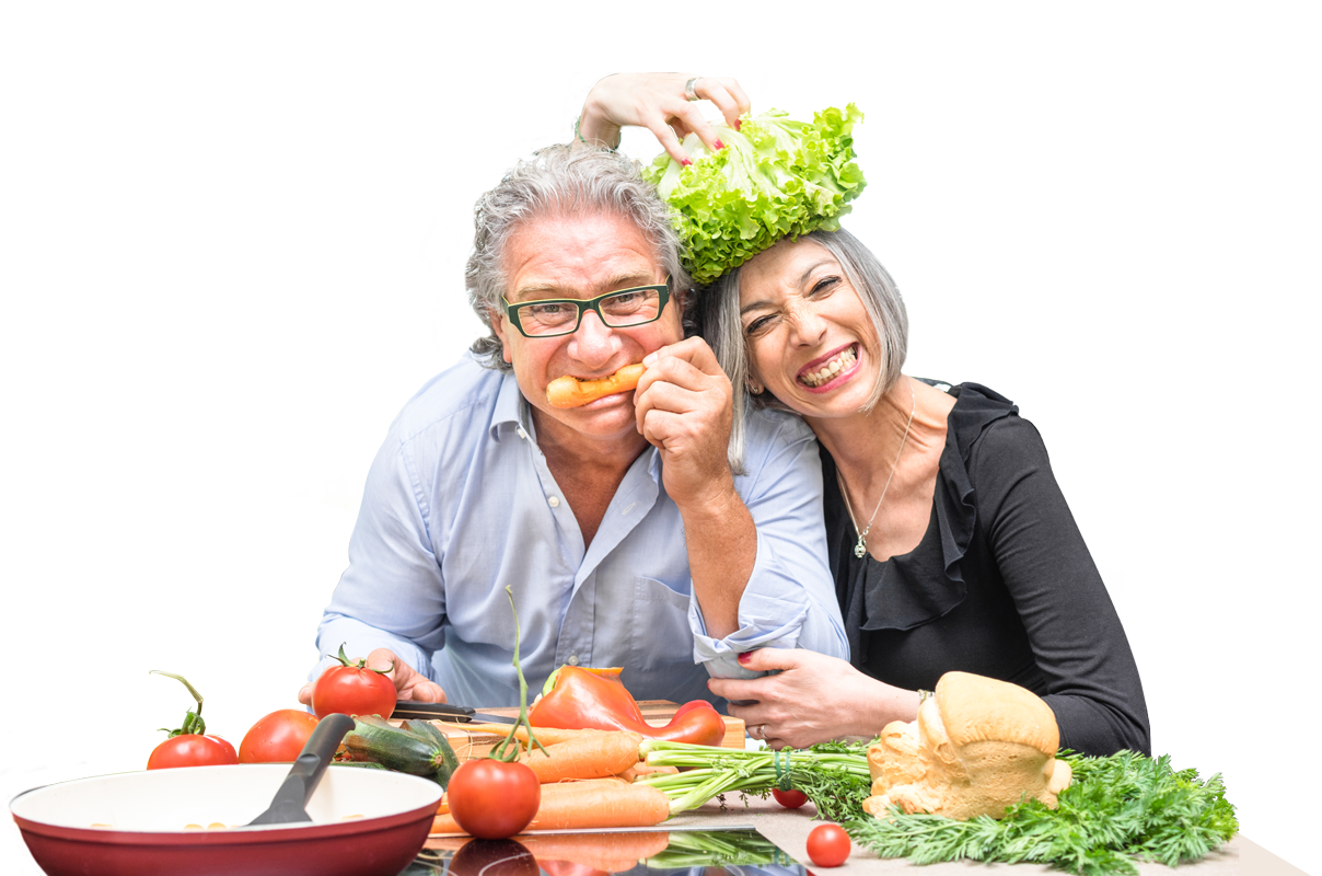 Two senior couple making a salad.